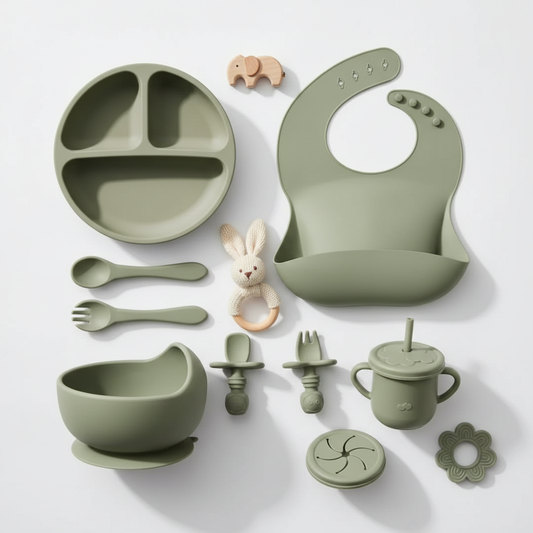 Professional studio photo of sage green silicone feeding set with props